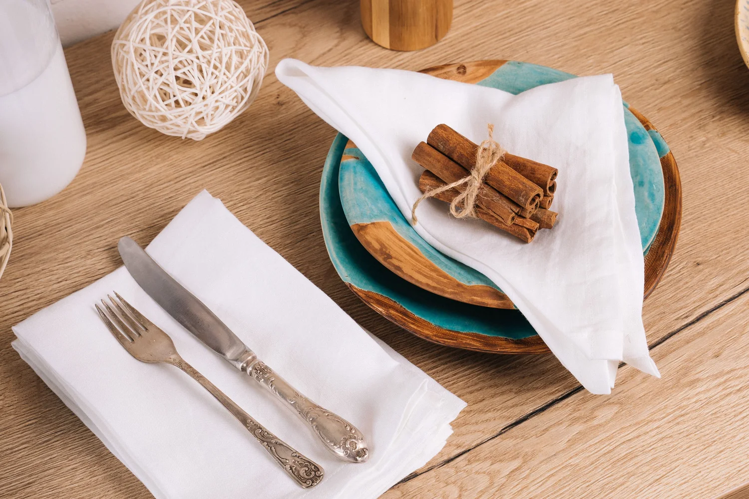 Kitchen utensils and cookware arranged in a bright domestic setting.